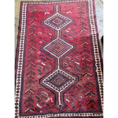 1019 - A Qashqai red ground rug, 226 x 160cm
