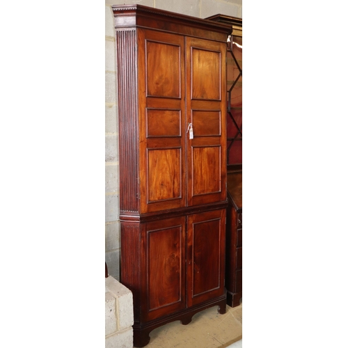 1027 - A George III mahogany standing corner cabinet, W.94cm, D.52cm, H.215cm