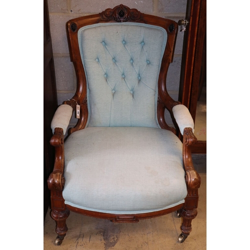 1030 - A Victorian mahogany open armchair
