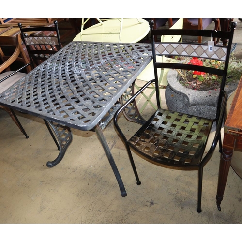 1038 - A square lattice metal garden table, W.83cm, H.76cm and two chairs