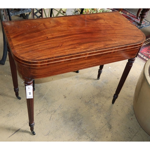 1039 - A Regency rosewood banded mahogany folding card table, W.86cm, D.43cm, H.73cm