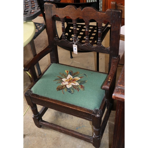 1043 - An 18th century and later oak elbow chair, W.58cm, H.75cm