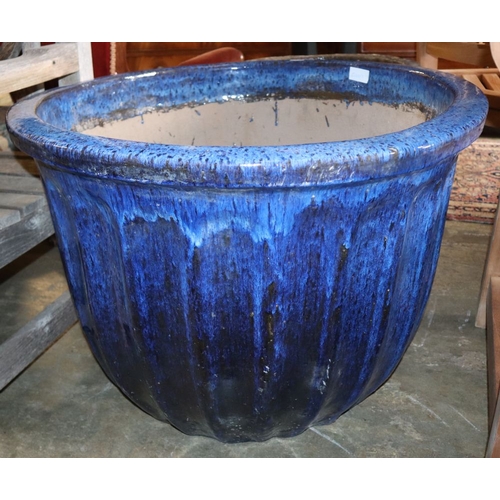1054 - A large blue glazed garden planter, 80cm diameter