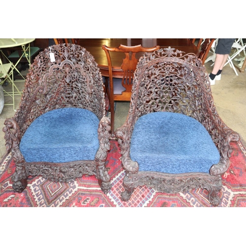 1057 - Two 19th century Anglo-Indian carved hardwood chairs, W.80cm, D.66cm, H.88cm