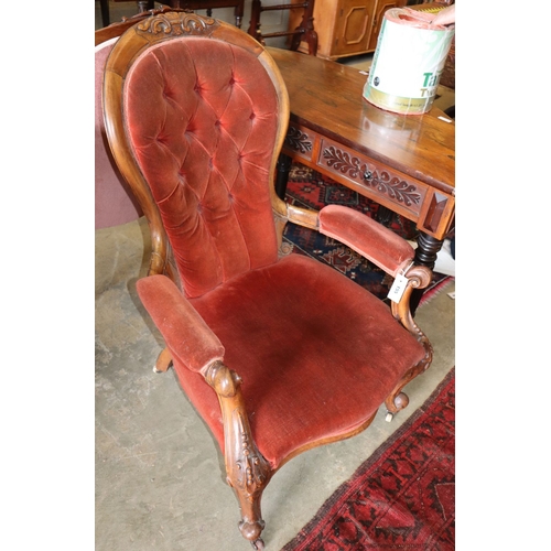 1062 - A Victorian mahogany spoonback armchair