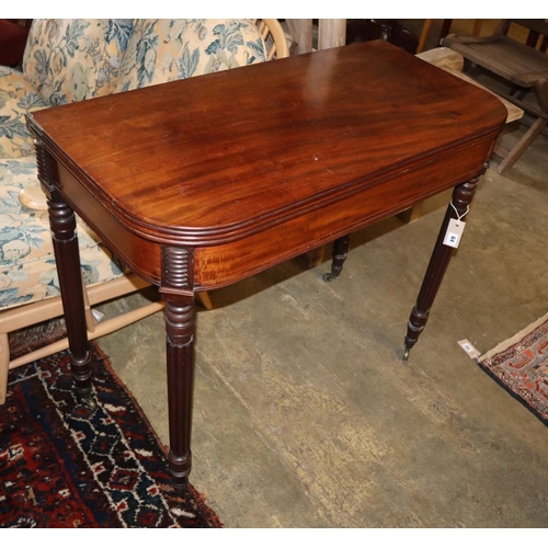 1064 - A Regency mahogany folding tea table, W.87cm, D.43cm, H.76cm