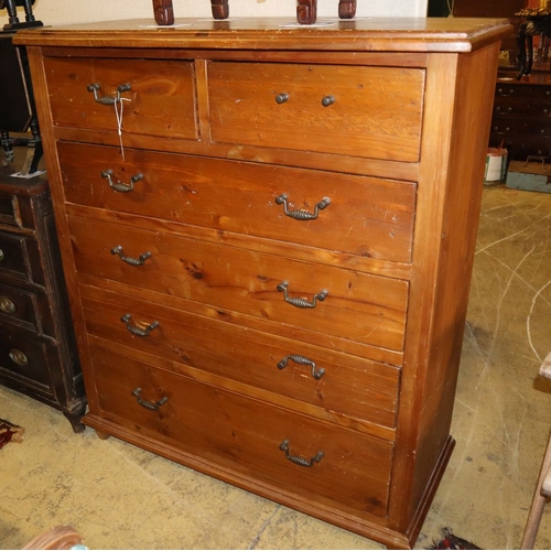 1065 - A stained pine chest of drawers, W.115cm, D.92cm, H.134cm