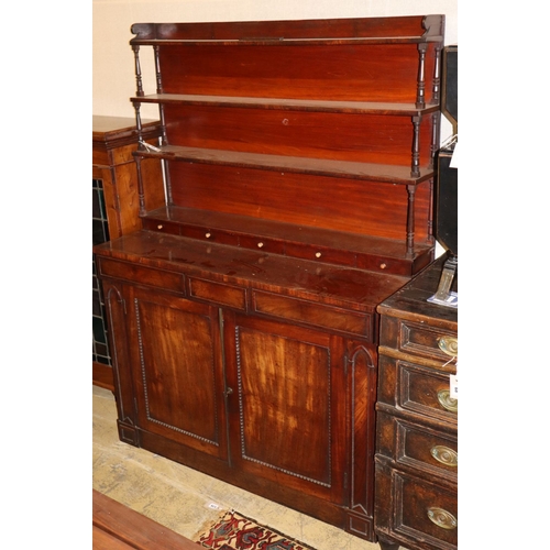 1069 - A late regency chiffonier sideboard with open rack over