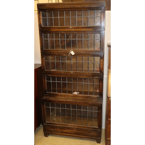 1076 - A five-section oak Globe Wernicke bookcase with leaded glass doors, W.85cm, D.34cm, H.188cm... 
