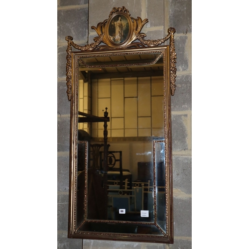 1089 - A reproduction gilt framed wall mirror, W.60cm, H.126cm