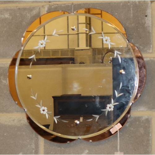 1100 - A 1950s peach and etched clear glass circular wall mirror, 57cm diameter