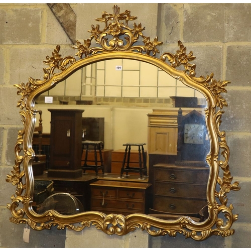 1104 - A reproduction gilt framed overmantel mirror, W.112cm, H.114cm