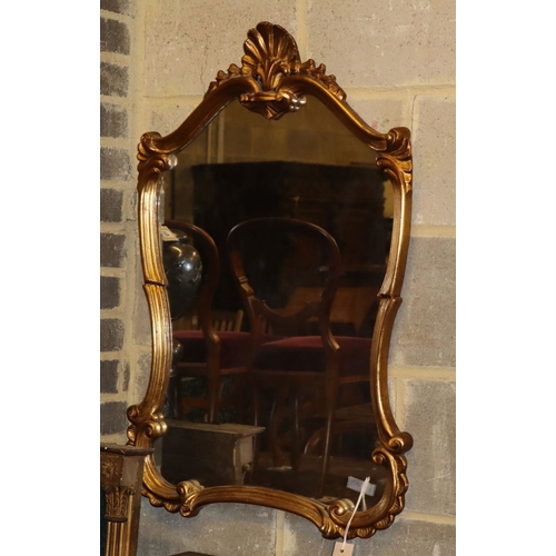 1111 - An 18th century style gilt framed cartouche shaped wall mirror, 58 x 86cm