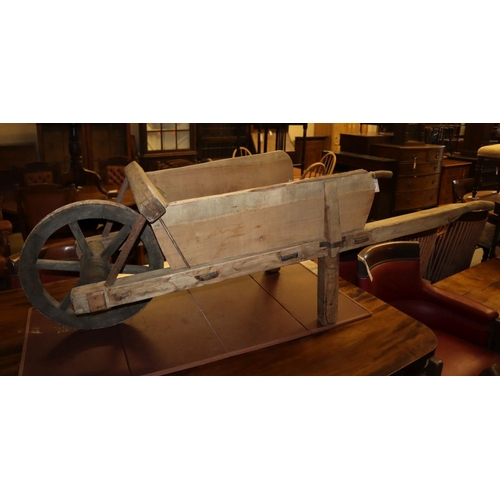 1123 - A vintage wooden garden wheelbarrow, L.176cm