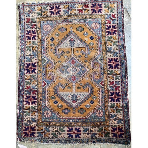 1129 - A Turkish gold coloured ground rug, 126 x 96cm