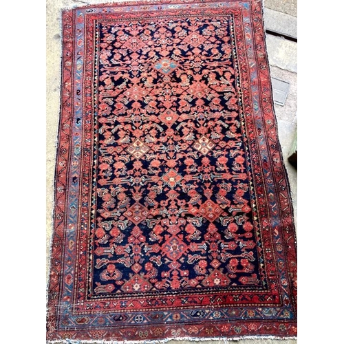 1131 - A Kurdish blue ground rug, 190 x 120cm