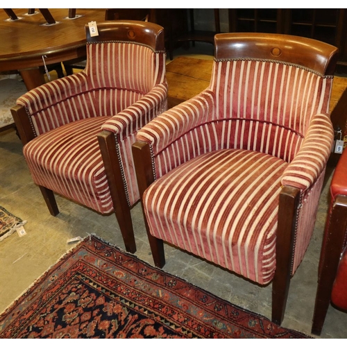 1132 - A set of four mahogany framed tub shaped theatre viewing armchairs, with red and cream striped uphol... 