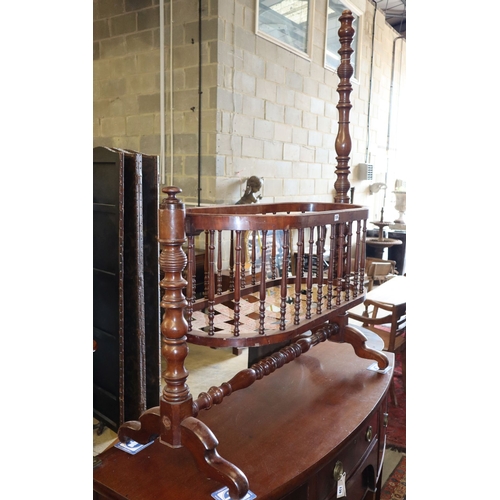 1146 - A 19th century French mahogany spindle cradle, W.116cm, D.50cm, H.160cm