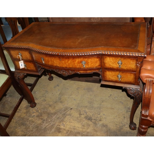 1158 - A Queen Anne style walnut bow front leather topped kneehole writing table, W.106cm, D.52cm, H.76cm... 