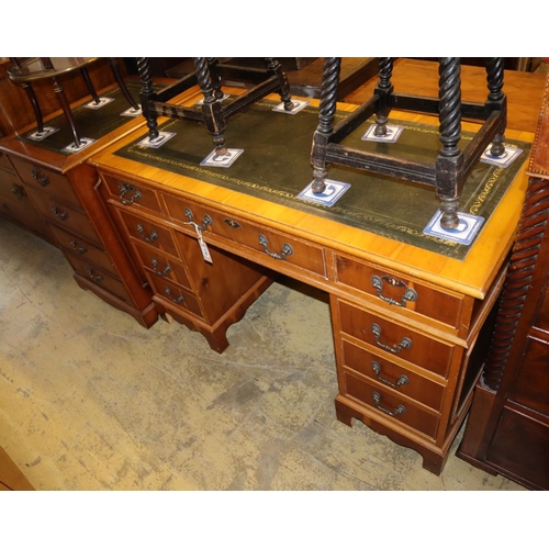 1170 - A reproduction yew pedestal desk, W.120cm, D.59cm, H.76cm together with a similar two drawer filing ... 
