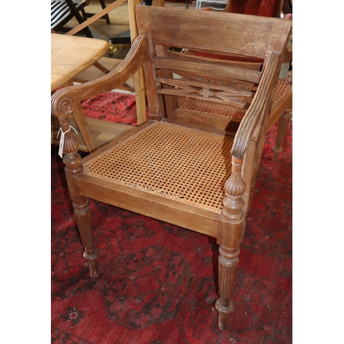 1173 - A set of six Anglo Indian teak cane seat elbow chairs