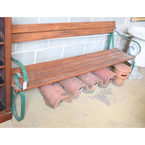 1174 - A wrought iron and slatted pine garden bench, W.195cm, D.60cm, H.84cm