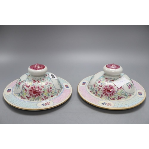 1209 - A pair of late 19th century Chinese famille rose covers, diameter 20.5cm