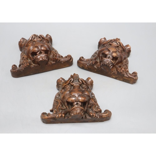 1227 - Three French carved walnut lion's masks, width 17cm