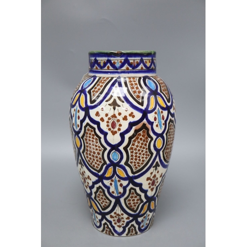 1228 - An early 20th century Isnik style pottery vase, height 34cm