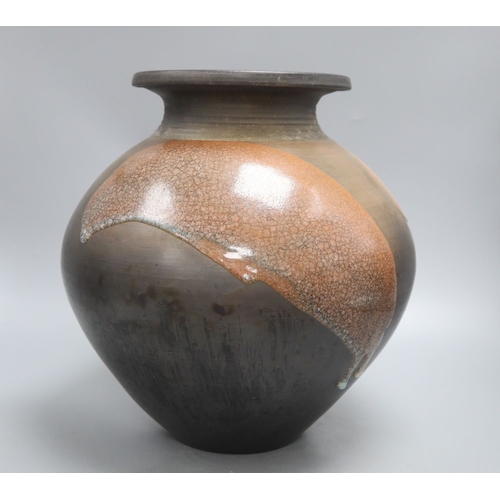 1234 - A Raku glazed studio pottery jug by Tim Andrews, height 34cm