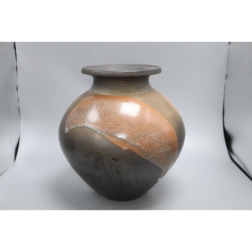 1234 - A Raku glazed studio pottery jug by Tim Andrews, height 34cm