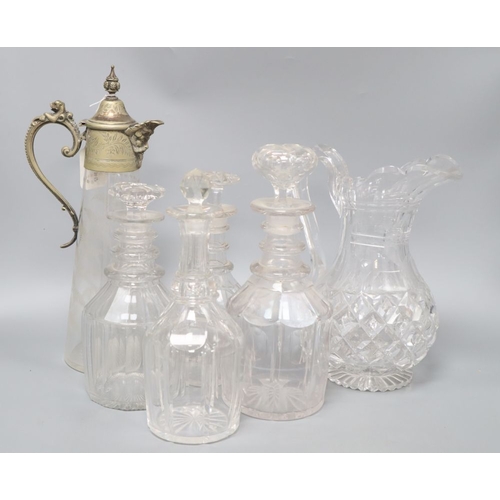 1276 - Four glass decanters, a claret jug and another jug, tallest 34cm