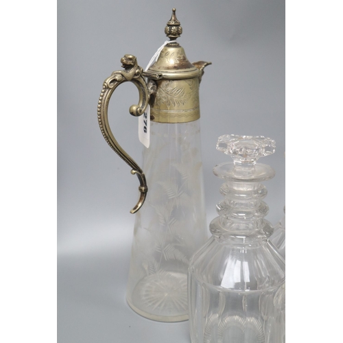 1276 - Four glass decanters, a claret jug and another jug, tallest 34cm