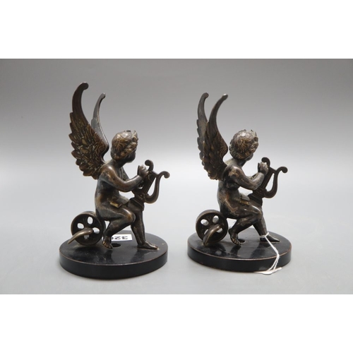 1320 - A pair of 19th century bronze cherub bookends, height 16cm