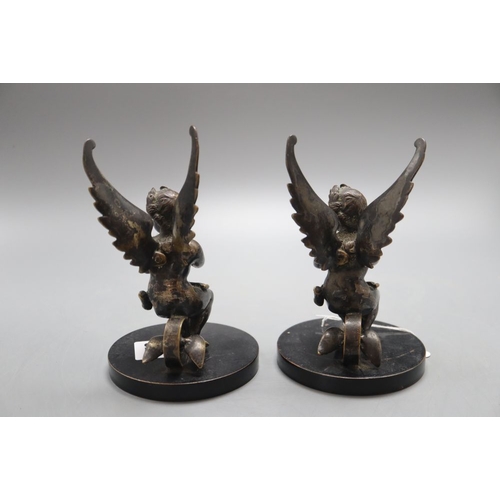 1320 - A pair of 19th century bronze cherub bookends, height 16cm