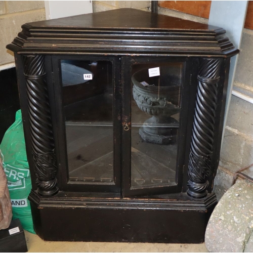 62 - A Flemish ebonised oak two door glazed floor standing corner cupboard, W.87cm