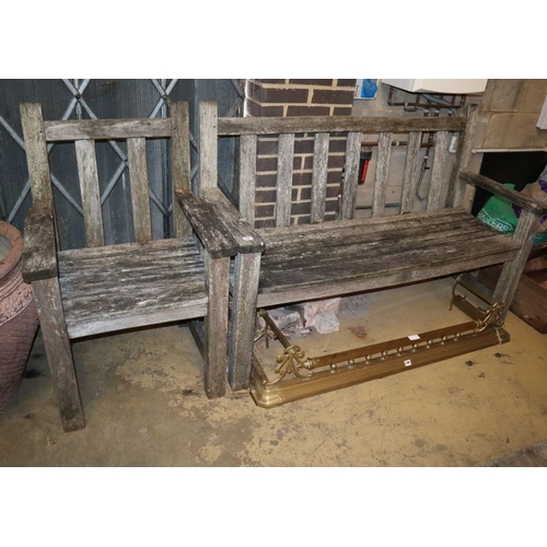 11 - A weathered teak garden bench and matching chair, bench W.150cm, D.52cm, H.98cm