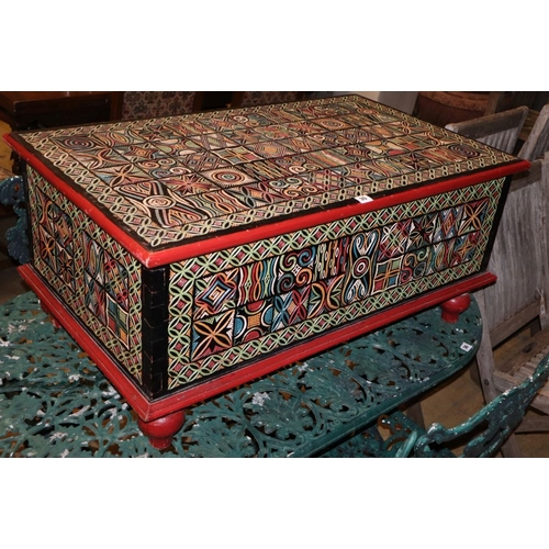 35 - An Indonesian carved painted hardwood coffer, W.99cm, D.59cm, H.45cm