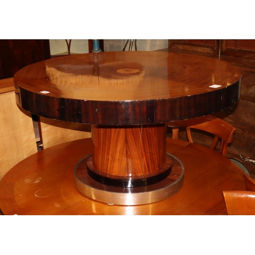 70 - A 1930's mahogany and ebonised circular topped coffee table, with chrome bordered plinth, diameter 9... 