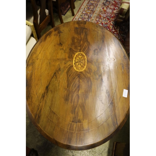 12 - A Victorian inlaid walnut oval topped tea table, width 104cm, depth 72cm, height 71cm, no bolts... 