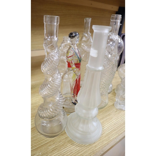 509 - Nine moulded glass bottles, including one coloured and formed as a matador tallest 33cmCONDITION: Pr... 