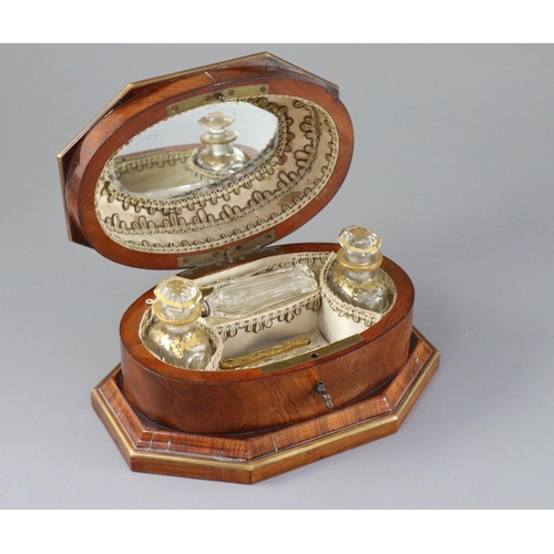 11 - A late 18th century Dutch brass bound kingwood necessaire, with gilt brass mounts, the lid opening t... 