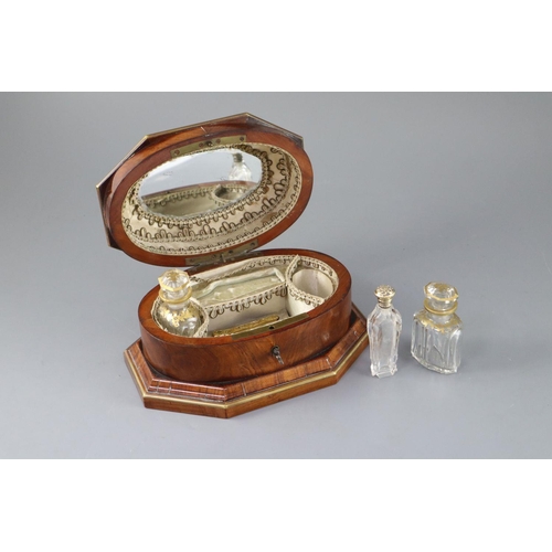 11 - A late 18th century Dutch brass bound kingwood necessaire, with gilt brass mounts, the lid opening t... 