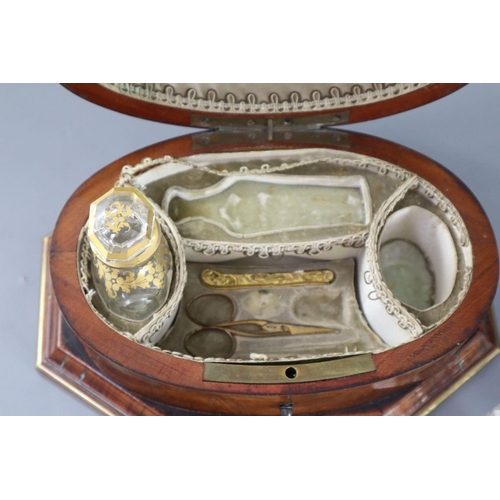 11 - A late 18th century Dutch brass bound kingwood necessaire, with gilt brass mounts, the lid opening t... 