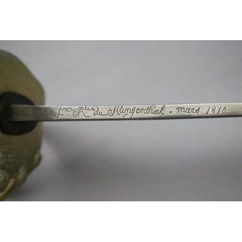 15 - An French heavy cavalry sword, with brass basket hilt and steel scabbard, signed on the blade Manufr... 