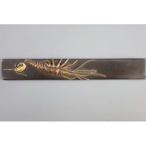 19 - A fine Japanese 'sea creatures' tanto, Meiji period, the saya lacquered to simulate wood grain and g... 