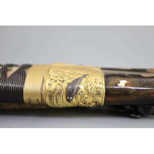 19 - A fine Japanese 'sea creatures' tanto, Meiji period, the saya lacquered to simulate wood grain and g... 