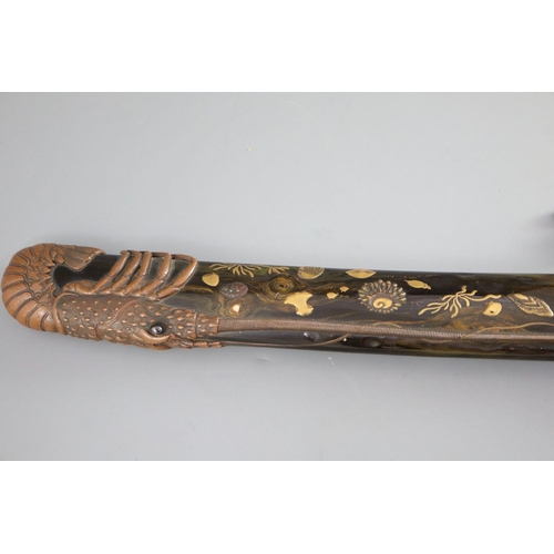 19 - A fine Japanese 'sea creatures' tanto, Meiji period, the saya lacquered to simulate wood grain and g... 