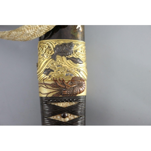 19 - A fine Japanese 'sea creatures' tanto, Meiji period, the saya lacquered to simulate wood grain and g... 
