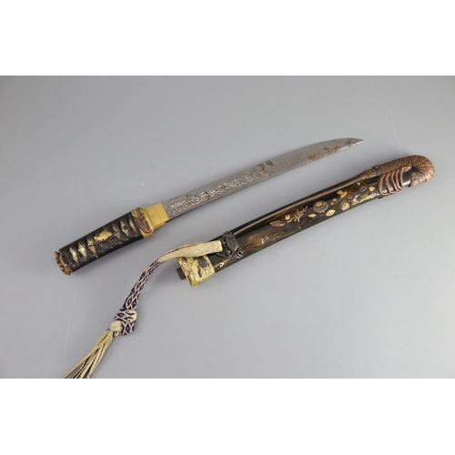 19 - A fine Japanese 'sea creatures' tanto, Meiji period, the saya lacquered to simulate wood grain and g... 